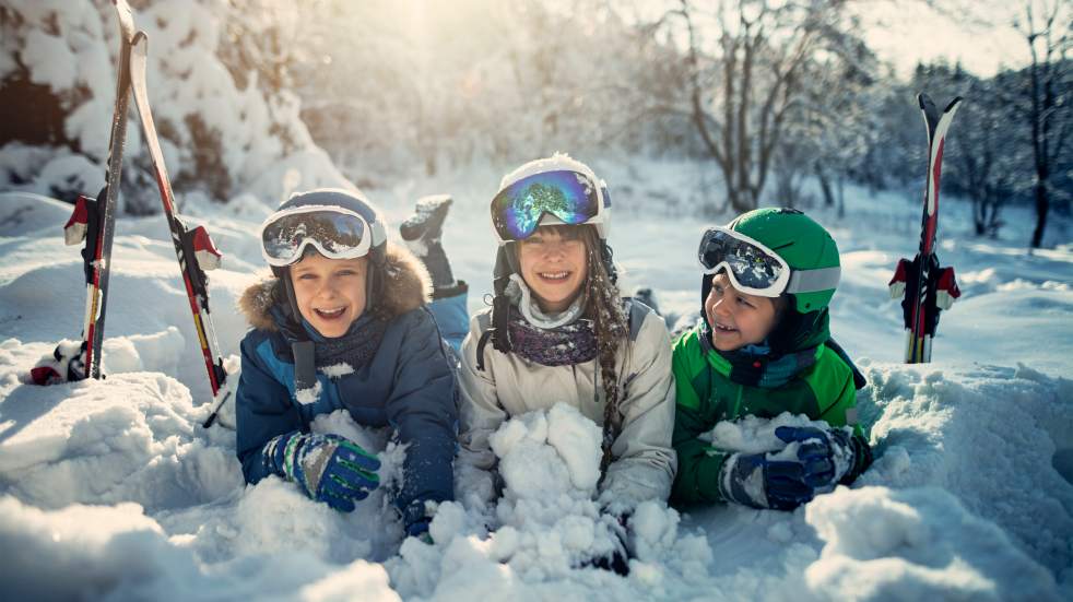 Children lying in snow